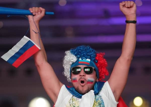 The World Cup is leaving Russian fans overjoyed  and contact with foreigners could help to change attitudes there. Picture: Christopher Furlong/Getty Images