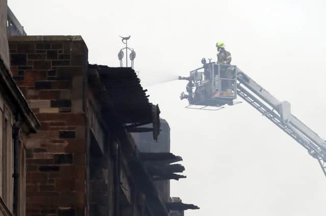 Firefighters battling the blaze. Picture: Andrew Milligan/PA Wire
