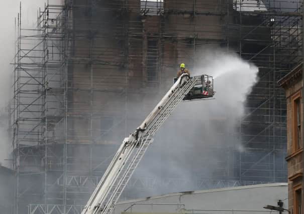 Firefighters at the historic Mackintosh Building in Glasgow. Pictute: Andrew Milligan/PA Wire