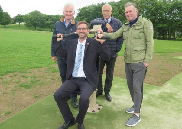 Pictured at the new outdoor gym at Mayfield Park are: Cllr John Hackett (sitting), Roy Auld, the Proludic area manager, Gary Cormack of the council's land and countryside service and Robert Hogg of the local community council.
