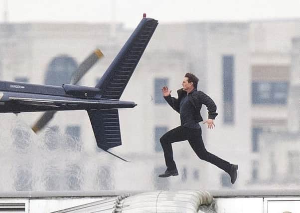 Tom Cruise, running PIC: Victoria Jones/PA Wire