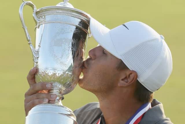 Brooks Koepka kisses the trophy after winning the US Open. Picture: Streeter Lecka/Getty Images