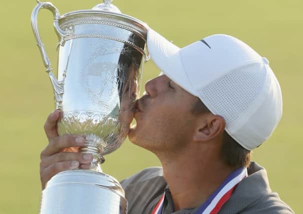 Brooks Koepka kisses the trophy after winning the US Open. Picture: Streeter Lecka/Getty Images