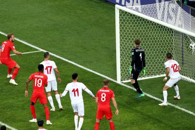 Harry Kane plants his header into the net during added time to earn victory for England. Picture: PA.