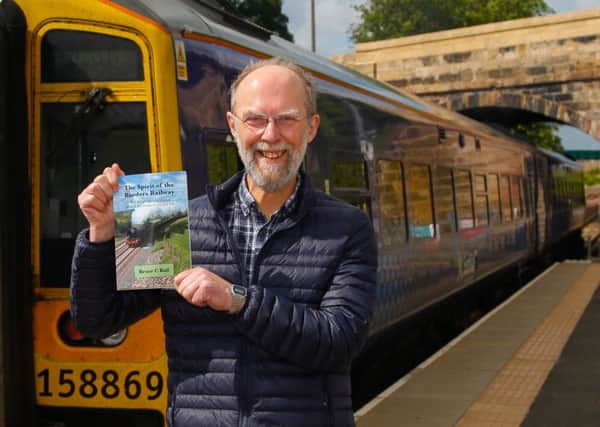 Bruce C Ball with his new book "The Spirit of The Borders Railway" photographed at Newtongrange Station by Scott Louden.
