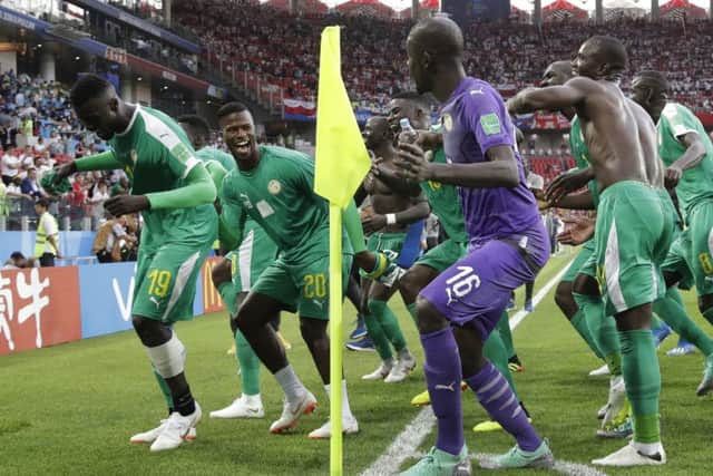 Senegal players celebrate their victory over Poland. Picture: AP.