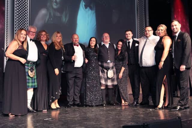 The Egan family from Masonry Solutions Ltd collect their Lanarkshire Business Award