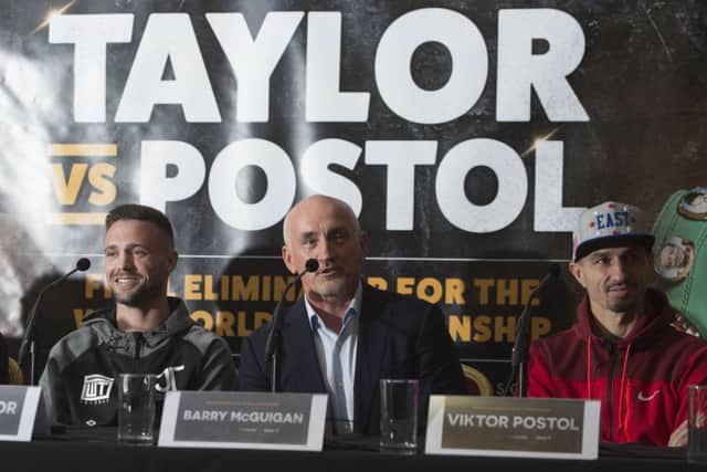 Josh Taylor, left, with promoter Barry McGuigan and Viktor Postol. Picture: Craig Foy/SNS