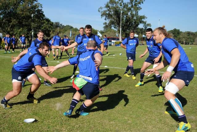 Nick Grigg tries to dodge his team-mates during a game of tag at Scotland training in Resistencia. Picture: ©Fotosport/David Gibson