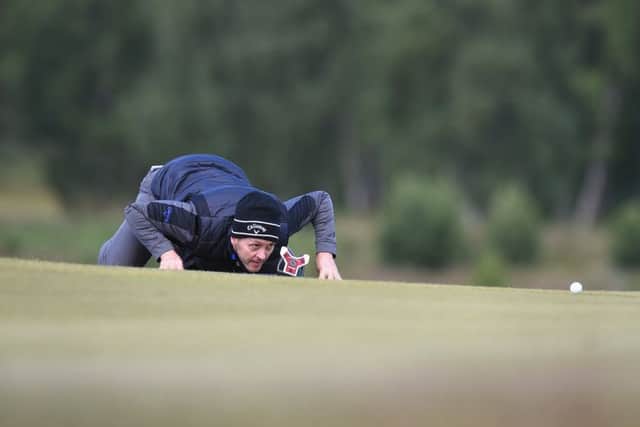 Welshman Stuart Manley gets the lowdown on a putt in the first round in Aviemore. Picture: Getty Images