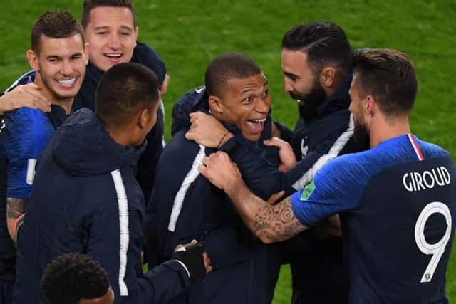 France's forward Kylian Mbappe (centre) celebrates with team-mates after scoring France's winning goal. Picture: AFP/Getty Images