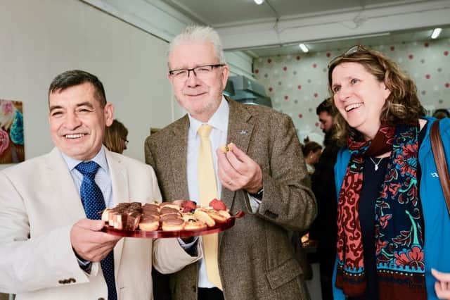 The opening of Helmi's Pattiserie. From left, Bashar Helmi, Michael Russell MSP, Morag Brown. Picture: Iain Cochrane.