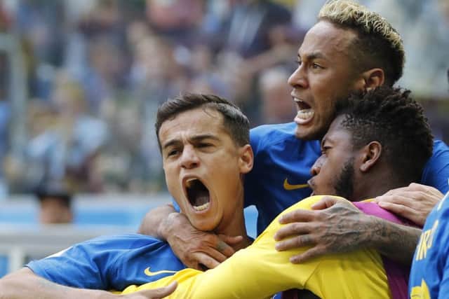 Philippe Coutinho celebrates with Neymar and team-mates after opening the scoring, Picture: Petr David Josek/AP