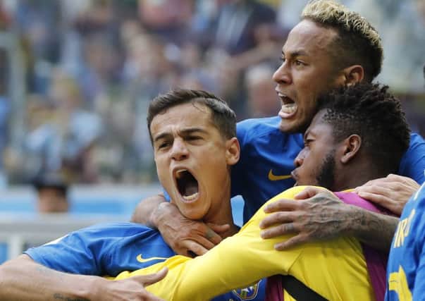 Philippe Coutinho celebrates with Neymar and team-mates after opening the scoring, Picture: Petr David Josek/AP