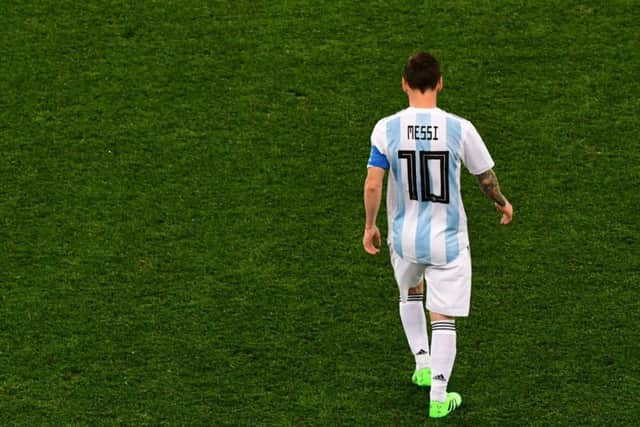 All alone: Lionel Messi has had nobody to support him, with Argentinas midfield being their weakest link. Picture: AFP/Getty.