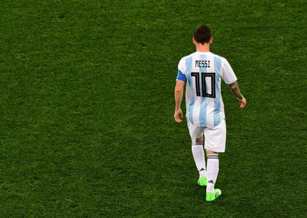 All alone: Lionel Messi has had nobody to support him, with Argentinas midfield being their weakest link. Picture: AFP/Getty.