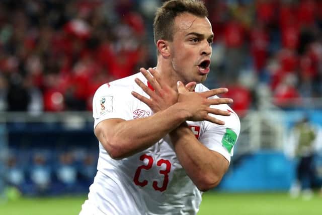 Xherdan Shaqiri celebrates his late strike for Switzerland. Picture: Getty.