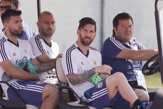 Lionel Messi, second from right, Sergio Aguero, left, and Javier Mascherano arrive for a training session in Bronnitsy. Picture: AP Photo