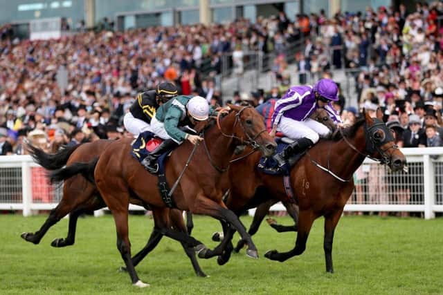Merchant Navy (right) ridden by Jockey Ryan Lee Moore wins the Diamond Jubilee Stakes. Picture: PA.
