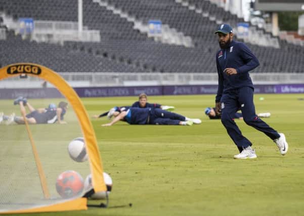England wicketkeeper Adil Rashid shows off his football skills during a nets session at Old Trafford. Picture: Getty.