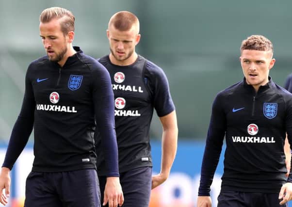 Harry Kane, Eric Dier and Kieran Trippier take a break during a training session in St Petersburg. Picture: Getty Images