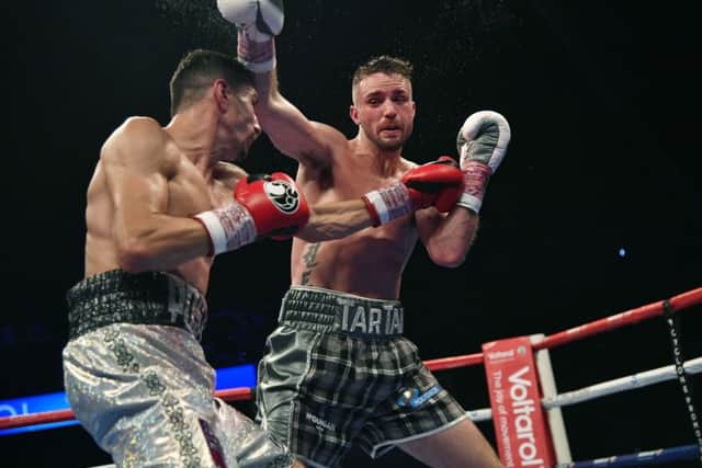 Josh Taylor goes on the offensive against Viktor Postol. Picture: SNS Group
