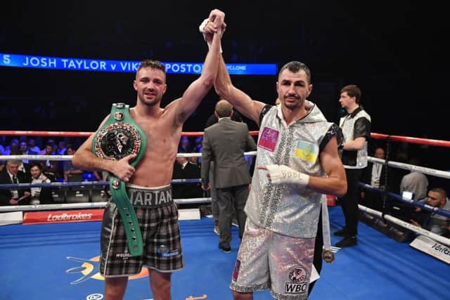 Josh Taylor celebrates after defeating Viktor Postol (right). Picture: Rob Casey/SNS