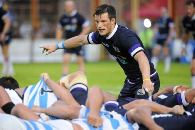 Scotland No 9 George Horne directs his backline at a scrum during the win over Argentina. Picture: Fotosport/David Gibson