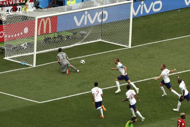 England's Harry Kane, top right, celebrates his first penalty during the 6-1 win over Panama. Picture: Darko Bandic/AP