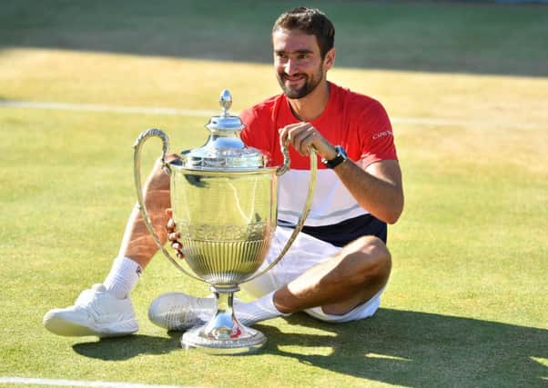 Marin Cilic poses with his trophy after defeating Novak Djokovic in the final of the Fever-Tree Championships at Queens yesterday. Picture: AFP/Getty