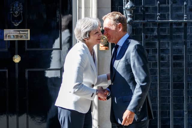 Theresa May greets European Council president Donald Tusk at Downing Street. Picture: AFP/Getty