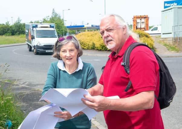 The groups' chairs Bill Kerr-Smith & Marnie Crawford at the proposed Starbucks and KFC  site.