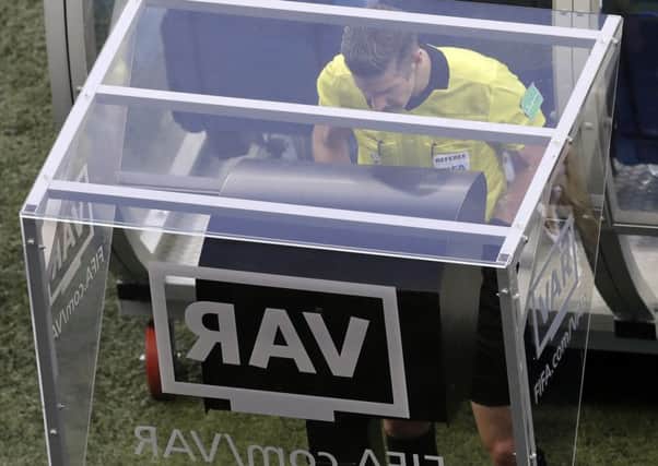 Referee Matt Conger watches the VAR system during the match between Nigeria and Iceland. Picture: AP