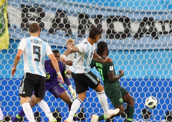 Marcus Rojo provides Argentina with a late winner to secure second place in Group D. Picture: Getty.