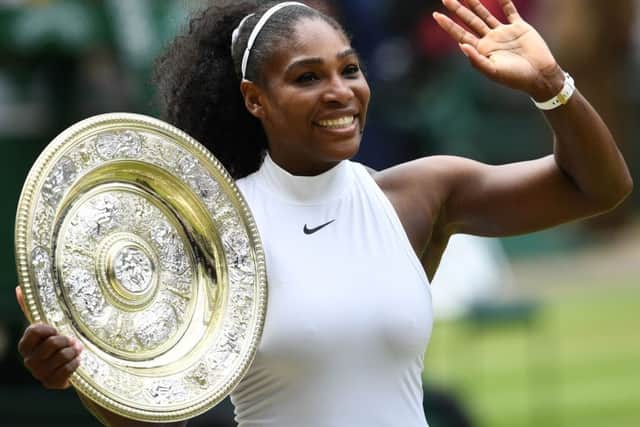 Serena Williams poses with the winner's trophy after her 2016 Wimbledon triumph. Picture: Glyn Kirk/AFP/Getty Images
