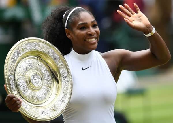 Serena Williams poses with the winner's trophy after her 2016 Wimbledon triumph. Picture: Glyn Kirk/AFP/Getty Images