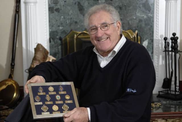 Harry Davis shows off the medals he won in his football career. Picture: Ian Rutherford