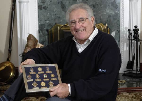 Harry Davis shows off the medals he won in his football career. Picture: Ian Rutherford