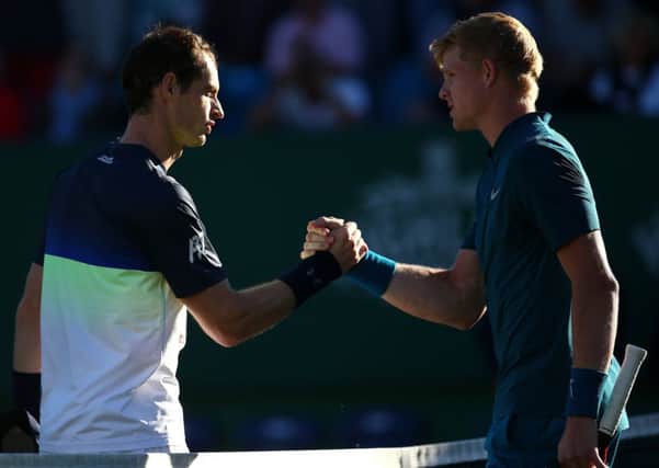 Kyle Edmund is congratulated by Andy Murray. Picture: Charlie Crowhurst/Getty Images for LTA