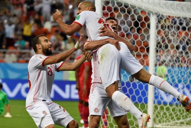 Wahbi Khazri (C) is congratulated by his Tunisia team-mates after scoring a goal against Panama. Picture: AFP/Getty.