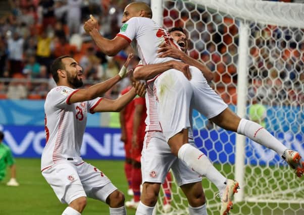 Wahbi Khazri (C) is congratulated by his Tunisia team-mates after scoring a goal against Panama. Picture: AFP/Getty.