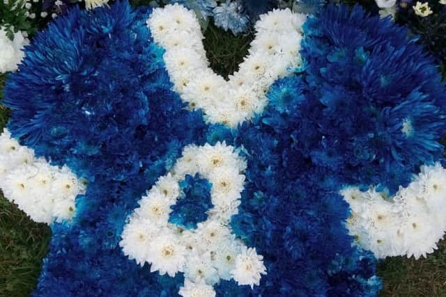 A floral tribute in the form of a Rangers No 4 jersey at the funeral of Harold Davis