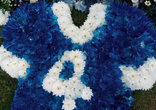 A floral tribute in the form of a Rangers No 4 jersey at the funeral of Harold Davis