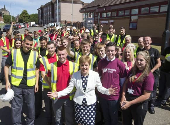 Nicola Sturgeon with apprentices from Wheatley Group and its partner organisation, City Building (Glasgow). Picture: Jeff Holmes