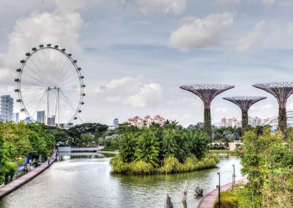 Singapore Marina Bay, where the Singapore Flyer ferris wheel and Supertree Grove are iconic of the garden city