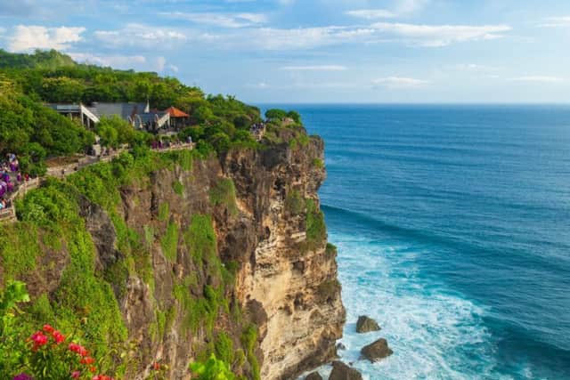 View of Uluwatu cliff with tourists, pavilion and blue sea in Bali, Indonesia

Bali and Singapore travel feature

Julie Douglas