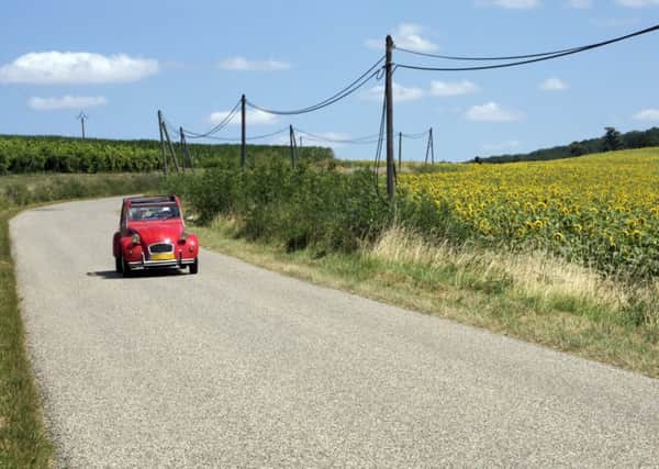 Touring wine country in a Citroen 2CV