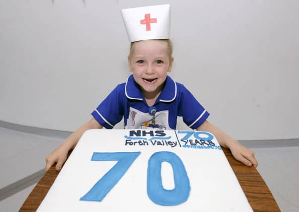 Five-year-old Freya McNab from Dunipace is keen to make an early start on her nursing career - and the cake!