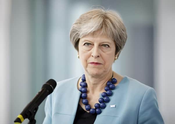 Theresa May. (Photo by Inga Kjer/Photothek via Getty Images)
