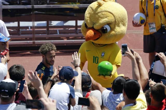 Brazil's mascot holds a football as fans cheer Neymar in Sochi, Russia. Picture: AP